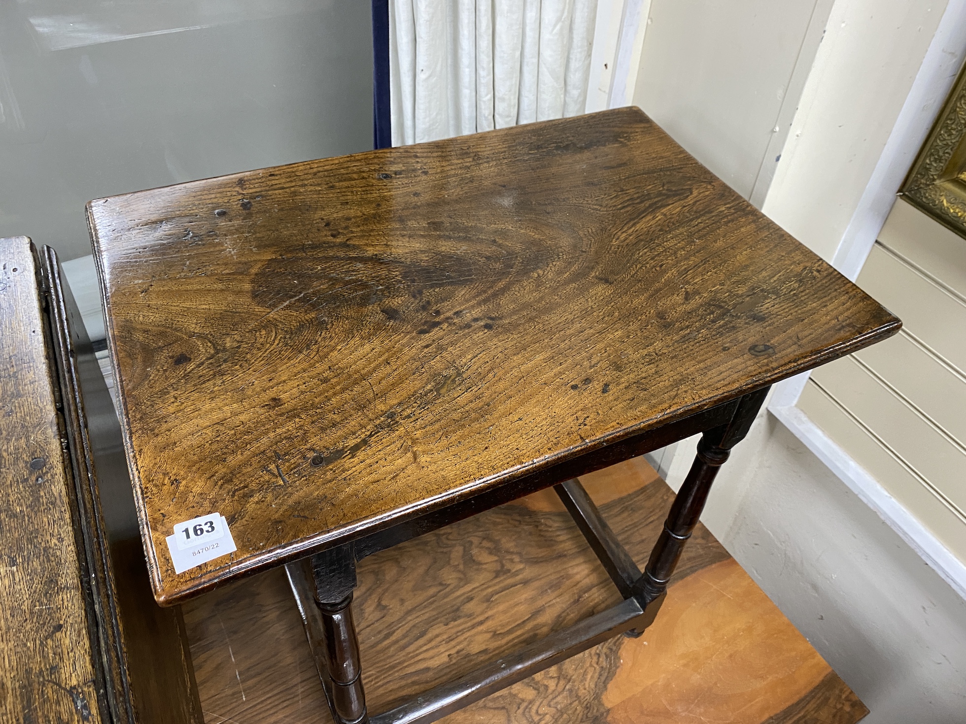 A late 17th century William and Mary oak and elm small rectangular centre table, the square and ring turned supports joined by peripheral stretchers, width 69cm, depth 48cm, height 66cm